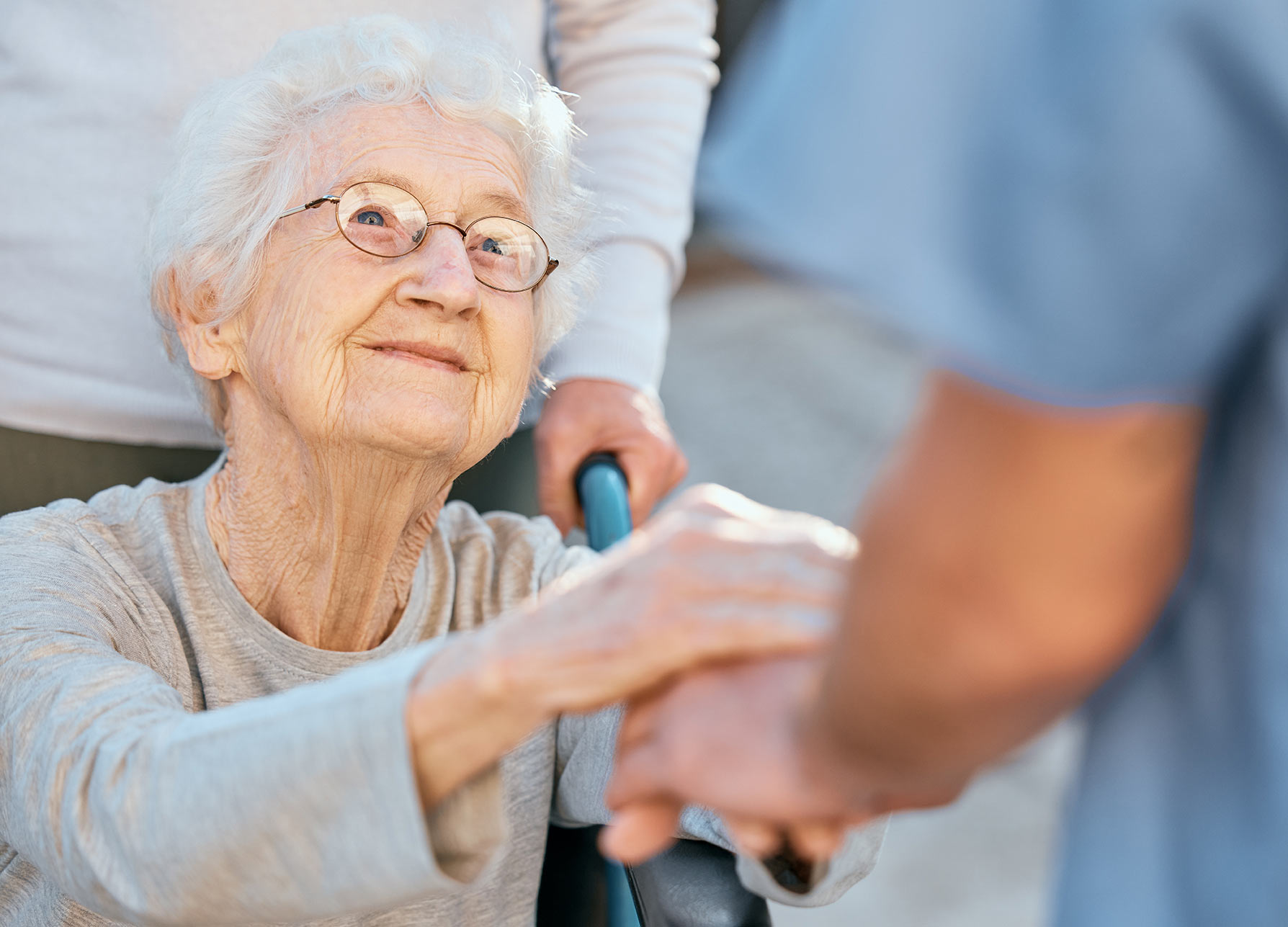 Caregiver comforting a senior woman with dementia at home in Calgary